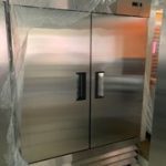A stainless steel refrigerator in a store.