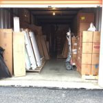 A storage unit with boxes and boxes in it.