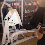 An exercise machine in a garage.