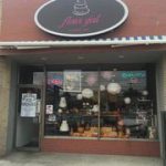 A bakery is on the corner of a street.