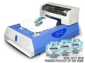 A t - shirt printing machine with a box of t - shirts.