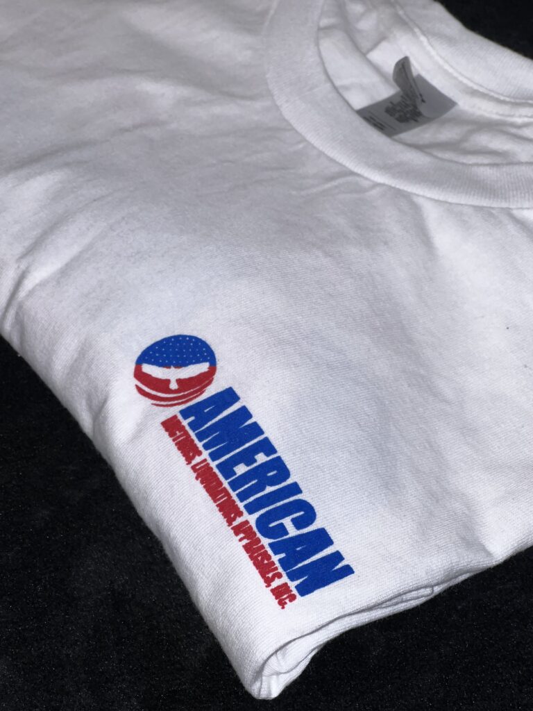 A white t shirt with the american flag on it.