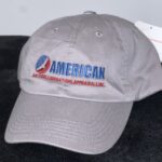 A gray hat with the american flag on it.
