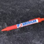 A red pen with the word american on it.