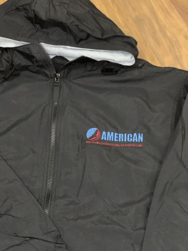 A black hooded jacket with the word american on it.