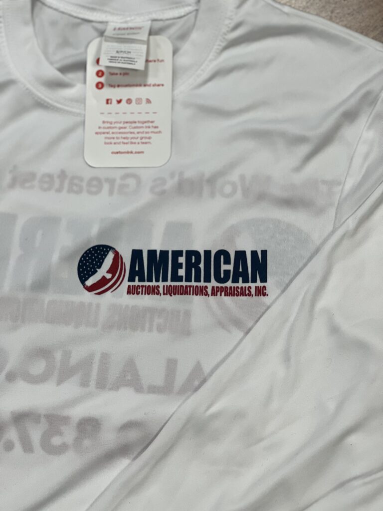 A white t shirt with the american flag on it.